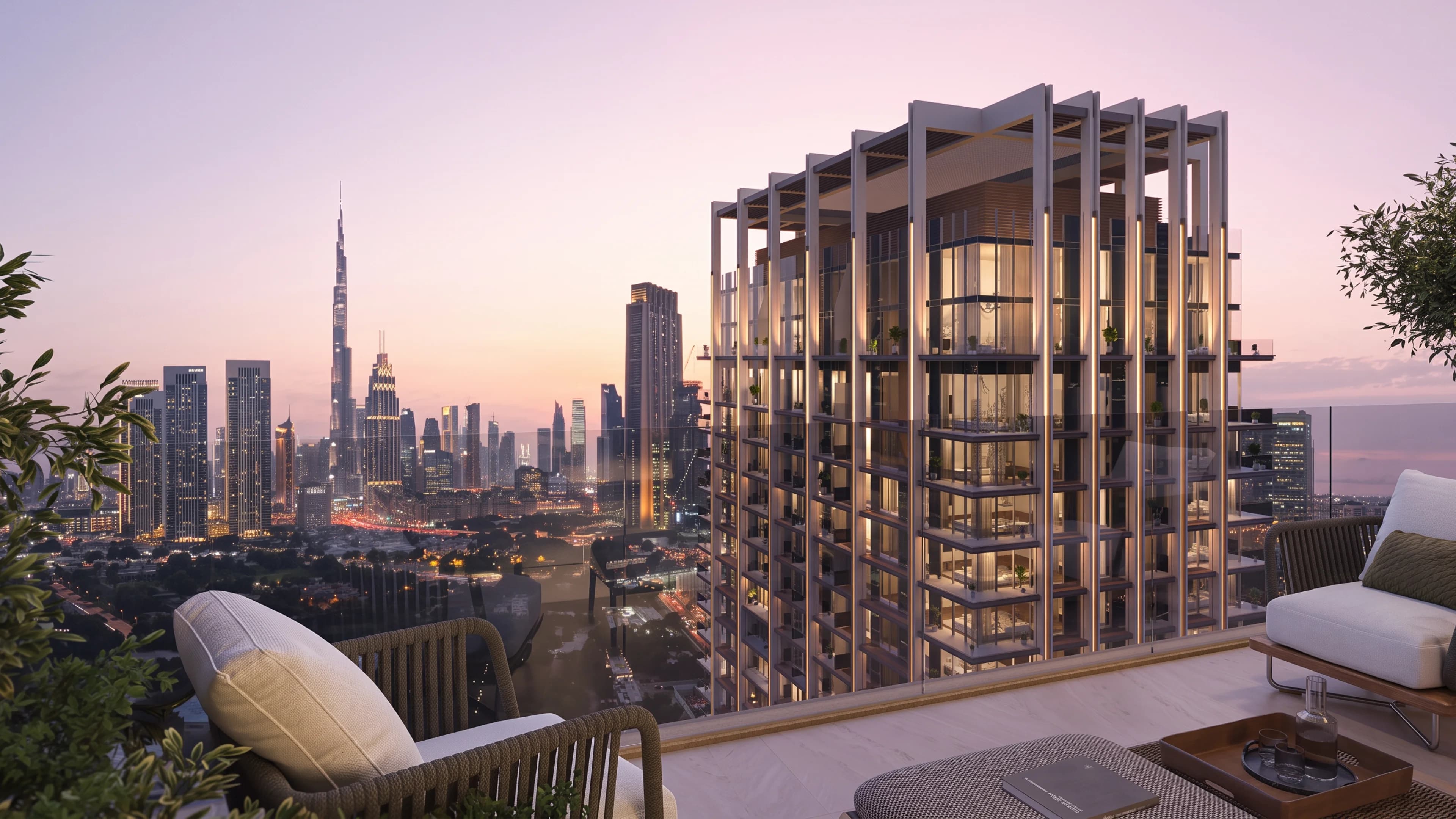 Rooftop terrace overlooking a modern residential tower and the Dubai skyline with the Burj Khalifa at dusk